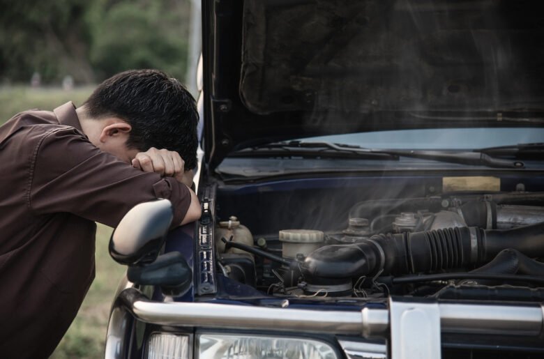 man-try-fix-car-engine-problem-local-road man-try-fix-car-engine-problem-local-road
